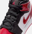 Air Jordan 1 Mid Grade School Lifestyle Shoe - Black/Varsity Red/White